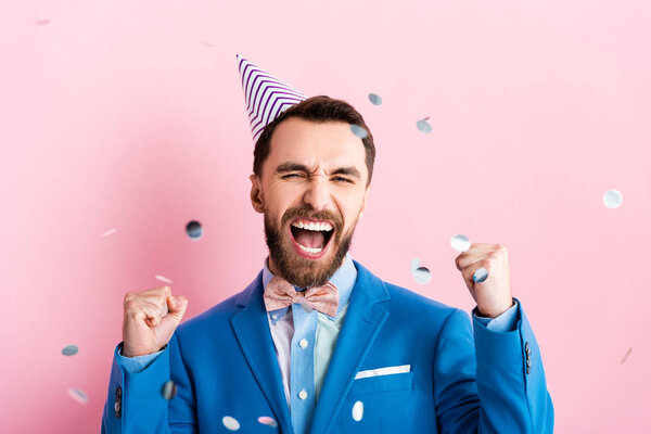 Excited Businessman Party Cap Celebrating Triumph Falling Confetti Pink — Stock Photo, Image