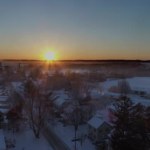 Aerial View of Early Morning Sunrise After a Snow Fall in Amish Farm Land and Countryside as Seen by a Drone